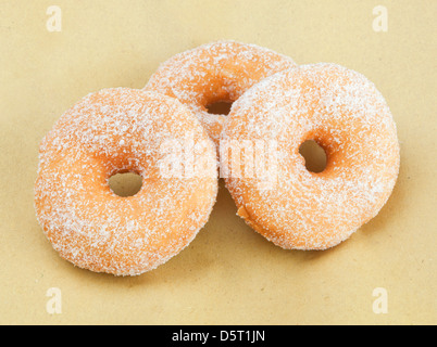 Donuts on beige paper background Stock Photo