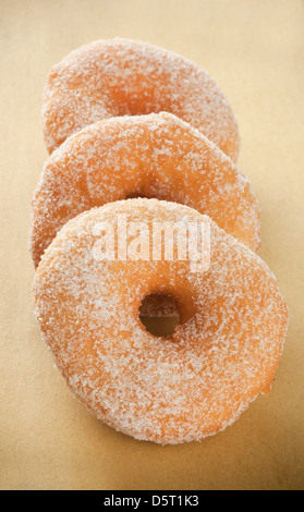 Donuts on beige paper background Stock Photo