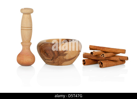 Cinnamon with mortar and pestle isolated on white background Stock Photo