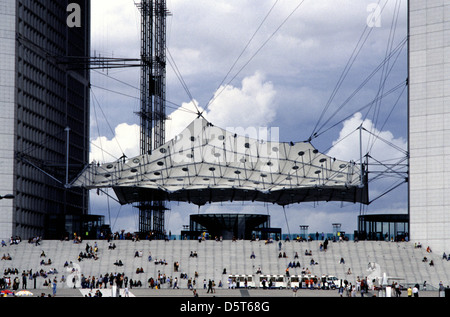 People visiting La Grande Arche de la Defense, 'The Great Arch of the Defense' also called La Grande Arche de la Fraternite monument and building in the business district of La Defense in Paris France Stock Photo