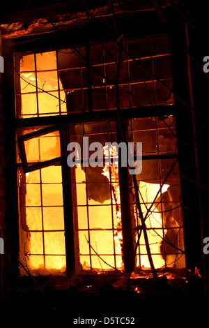 Fire in Building the flame comes out of the window Stock Photo