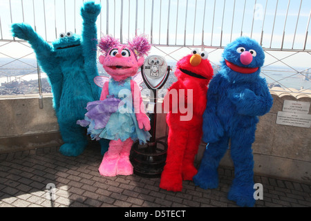 Cookie Monster, Abby Cadabby, Elmo and Grover Sesame Street characters visit the top of the Empire State Building to promote Stock Photo