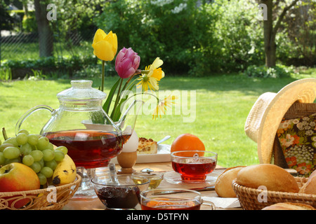 Breakfast tea and simple food in the garden. Stock Photo