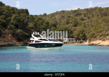 The new Pearl 75 luxury motor yacht - destined for Palma Boat Show 2013 - at anchor in Portals Vells - a popular cala / bay. Stock Photo