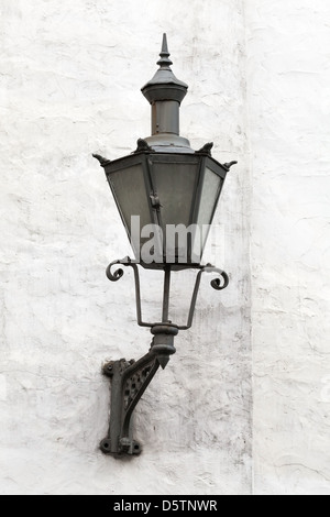 Old Lantern on a white wall in Tallinn, Estonia Stock Photo