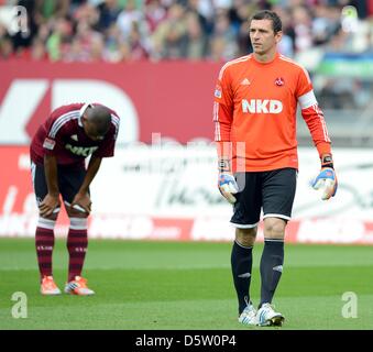 Nuremberg's goalkeeper Raphael Schaefer (R) and teammate Marcos Antonio stand on the pitch after Stuttgart's 0-1 goal during the German Bundesliga match between FC Nuremberg and VfB Stuttgart at easyCredit Stadium in Nuremberg, Germany, 29 September 2012. Photo: DAVID EBENER  (ATTENTION: EMBARGO CONDITIONS! The DFL permits the further utilisation of up to 15 pictures only (no sequn Stock Photo