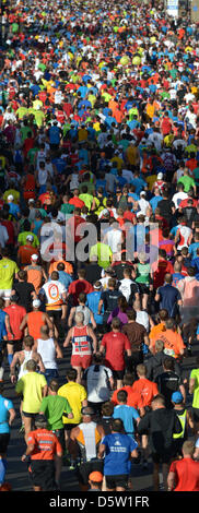 A field of runners is pictured after the start of the 39th Berlin Marathon on Strasse des 17. Juni in Berlin, Germany, 30 September 2012. About 41 000 participants have registered for the 42,195 track that leads them across the German capital. Photo: Rainer Jensen Stock Photo