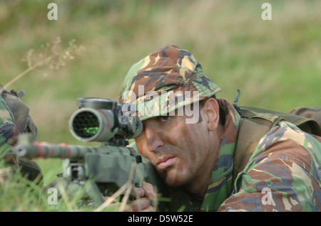 a sniper team of two one shooter and one sporter. The sporter will locate the target for the shooter Stock Photo