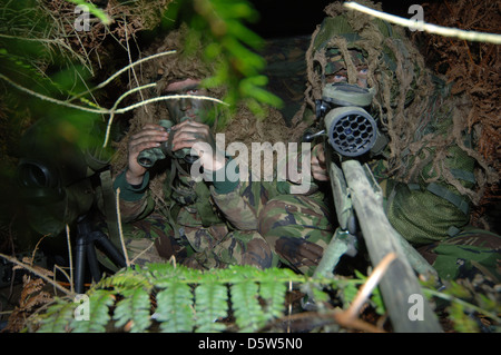 a sniper team of two one shooter and one sporter. The sporter will locate the target for the shooter Stock Photo