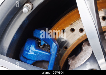 Detail close up of a motor vehicle or car disc brake showing the rotor and the Stock Photo