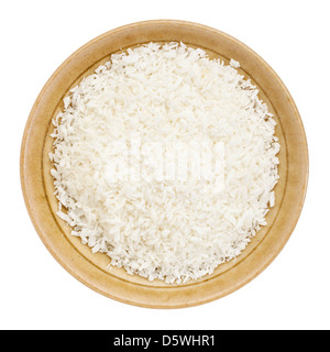 shredded coconut flakes in a small ceramic bowl isolated on white, top view Stock Photo