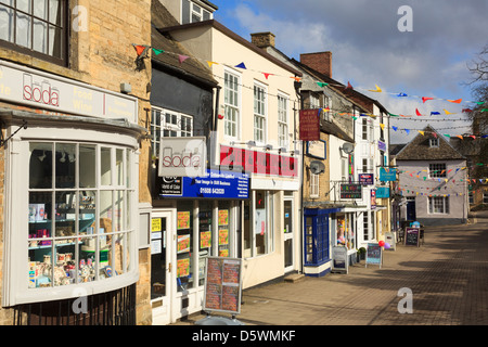Quaint old shops in the old Cotswold town centre in Chipping Norton, Oxfordshire, England, UK, Britain Stock Photo