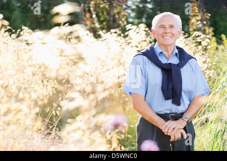 Smiling older man standing outdoors Stock Photo