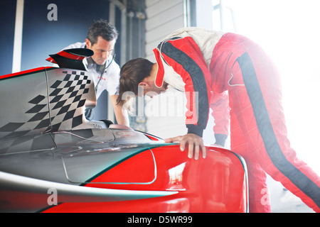 Racing team working on car Stock Photo