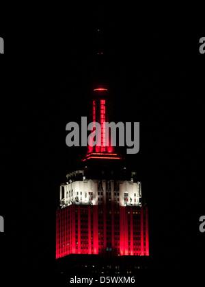 New York, USA. 8th April 2013. The Empire State Building celebrates tonight's NCAA Men's Basketball Final by illuminating the towers in the colors of champion Louisville, Monday, April 8, 2013. (Credit Image: Credit:  Bryan Smith/ZUMAPRESS.com/Alamy Live News) Stock Photo