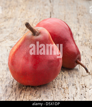 red pears on a wooden table Stock Photo