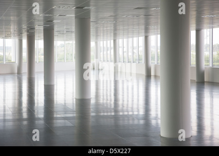 Pillars in empty office building Stock Photo