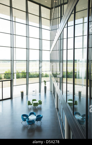 Chairs and tables in office lobby area Stock Photo