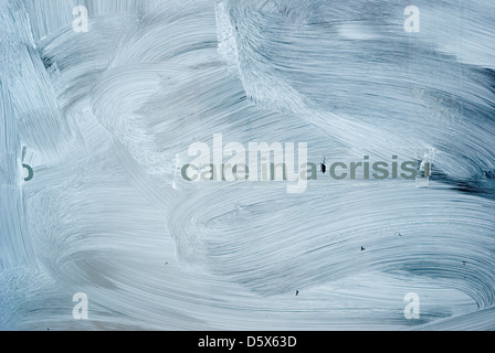 Message on a whited out window, relevant to today's social crisis. Stock Photo