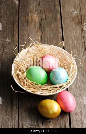 Colored Easter eggs in nest of grass isolated on white Stock Photo - Alamy