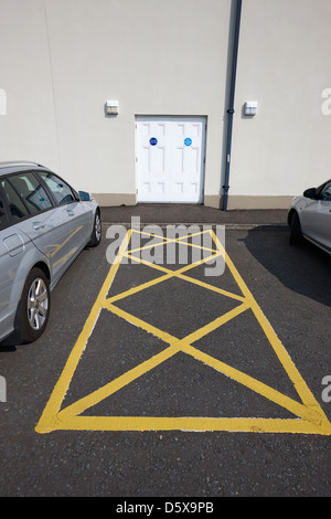 fire exit keep clear emergency doors and car park markings in a public access building moira county down northern ireland uk Stock Photo