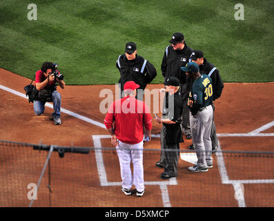 Anaheim, California, USA. 9th April 2013. Coaches, Umpites meet prior to the Major League Baseball Home Opener game between the Oakland Athletics and the Los Angels at Angel Stadium in Anaheim, CA John Green/CSM/Alamy Live News Stock Photo