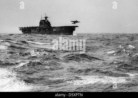 A U.S. AAF North American B-25B 'Mitchell' medium bomber, one of sixteen involved in the 'Doolittle Raid' mission, takes off from the flight deck of the USS HORNET (CV-12) for an air raid on the Japanese Home Islands, on April 18, 1942. Stock Photo