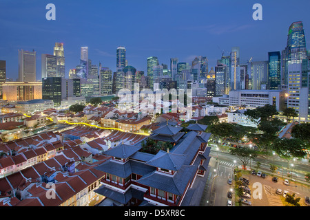 Singapore City Central Business District (CBD) Over Chinatown Area with Old Houses and Chinese Temple at Blue Hour Stock Photo
