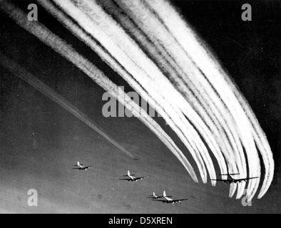 Boeing B-17 'Flying Fortress' vapor trails fill the sky. Stock Photo