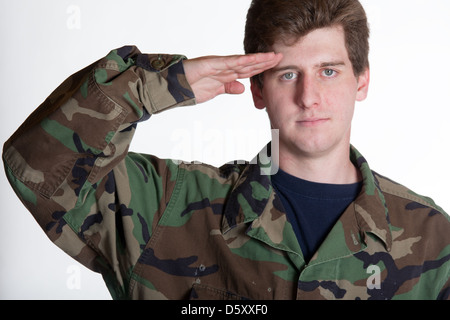 Young soldier saluting in camera Stock Photo