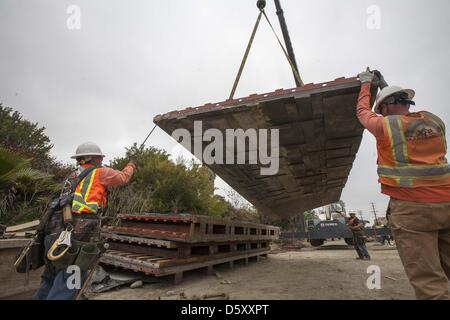 March 27, 2013 - Los Angeles, California, U.S - Workers move the wall panel at the site of the construction of the Metro Expo Line extension at National and Palms boulevards in Los Angeles. Exposition Transit Corridor, Phase 2 will extend westward to Santa Monica from the Metro Expo Line Culver City Station and run along the old Pacific Electric Exposition right-of-way to 4th St. and Colorado Av. in downtown Santa Monica. The 6.6 mile second phase will connect Santa Monica by rail to Downtown LA, Pasadena, San Fernando Valley, South Bay, Long Beach and dozens of points in between. With seven n Stock Photo