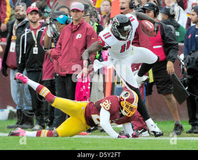 Atlanta Falcons wide receiver Julio Jones (11) is tackled by Washington Redskins cornerback Josh Wilson (26) in second quarter action at FedEx Field in Landover, Maryland on Sunday, October 7, 2012..Credit: Ron Sachs / CNP Stock Photo