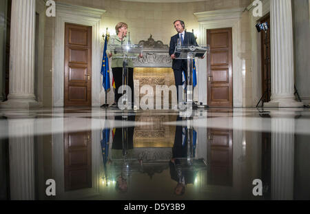 Greek Premier Antonis Samaras and German Chancellor Angela Merkel hold a press conference in Athens, Greece, 09 October 2012. German Chancellor Merkel is on a visit to Greece for the first time after the beginning of the Euro debt crisis. Photo: HANNIBAL Stock Photo