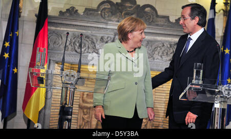 Greek Premier Antonis Samaras and German Chancellor Angela Merkel hold a press conference in Athens, Greece, 09 October 2012. German Chancellor Merkel is on a visit to Greece for the first time after the beginning of the Euro debt crisis. Photo: HANNIBAL Stock Photo