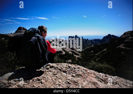 Young woman on a trek in the mountains of Montserrat, Barcelona, Spain. Stock Photo