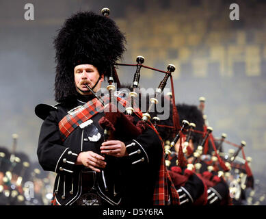 120 Scottish bagpip players perform during the 'Music Show Scotland' in Saarbruecken, Germany 13 October 2012. Photo: Becker&Bredel Stock Photo