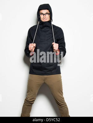 Man Adjusting Hooded Jacket