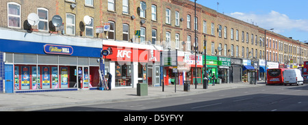 Shopping street and shop units with flats above in Canning Town Stock Photo: 55309607 - Alamy