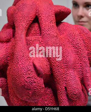 A woman looks at an object by a designer from Copenhagen at the Grassi Museum for Applied Arts in Leipzig, Germany, 25 October 2012. Around 100 exhibitors from all of Europe are presenting current hand made art and design from 26 until 28 October 2012. Photo: HENDRIK SCHMIDT Stock Photo