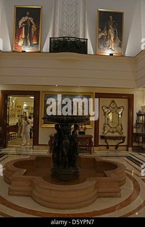 Old paintings hang on the walls at Delhi's oldest 5-star hotel, The Imperial in New Delhi, India Stock Photo