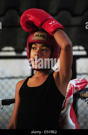 A pupil of the Cuban state boxing school 'Gimnasio de Boxeo Rafael Trejo' practices in the ring in Havanna, Cuba, 28 March 2012. Photo: Marco Hadem Stock Photo