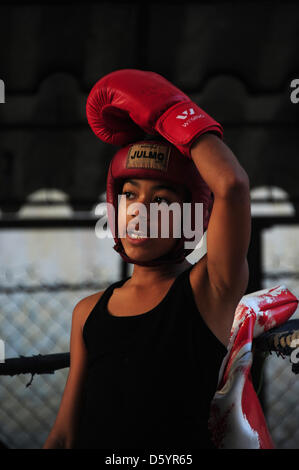 A pupil of the Cuban state boxing school 'Gimnasio de Boxeo Rafael Trejo' practices in the ring in Havanna, Cuba, 28 March 2012. Photo: Marco Hadem Stock Photo