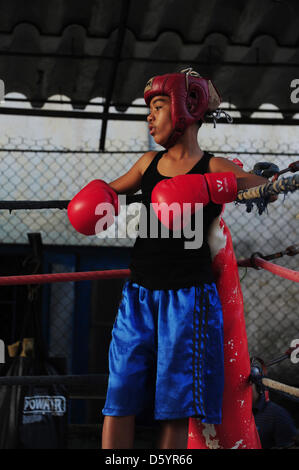 A pupil of the Cuban state boxing school 'Gimnasio de Boxeo Rafael Trejo' practices in the ring in Havanna, Cuba, 28 March 2012. Photo: Marco Hadem Stock Photo