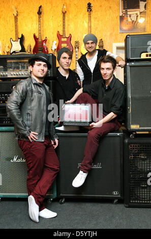 Djavan (l-r), Simon, Malte and Basti of music band Tree Inc. pose in a music store in Muenster, Germany, 02 November 2012. The pop group competes in the final of the 'local heroes' in Salzwedel on 03 November 2012. Photo: Friso Gentsch Stock Photo