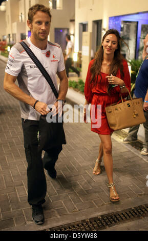 British Formula One driver Jenson Button of McLaren Mercedes and his girlfriend, Japanese Jessica Michibata, seen after the qualification session at the Yas Marina Circuit in Abu Dhabi, United Arab Emirates, 03 November 2012. The Formula One Grand Prix of Abu Dhabi will take place on 04 November 2012. Photo: Jens Buettner/dpa Stock Photo