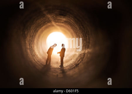 Two businessmen talk within a tunnel. Stock Photo