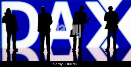 (ILLUSTRATION) An illustration dated 09 November 2012 shows small plastic figures in front of the logo of the DAX (Deutscher Aktienindex/German Stock Index) in Berlin, Germany, 09 November 2012. Photo: Sven Hoppe Stock Photo