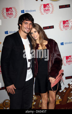 German football player Mats Hummels and Cathy Fischer arrive for the MTV Europe Music Awards (EMA) at Festhalle in Frankfurt, Germany, on 11 November 2012. The music TV channel's award ceremony is in its 19th year and recognizes talent on the European music scene. Photo: Hubert Boesl Stock Photo