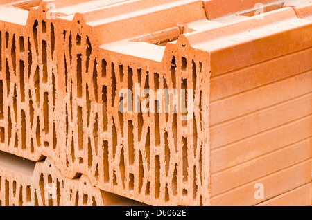 Stack of clay bricks in a warehouse Stock Photo
