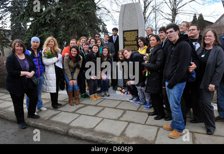 American students of the Holocaust Study Tour led by program manager Colleen Tambusci (left) are seen during the unveiling of the monument Righteous Among the Nations and victims of holocaust in Trsice, Czech Republic, March 10, 2013. Other memorial stone was unveiled there last year. It was near to the forest shelter which was hiding a Jewish family Wolf in 1942-1945. The story of this family became famous in the world thanks Diary of Otto Wolf, equated to the Diary of Anne Frank. (CTK Photo/Ludek Perina) Stock Photo